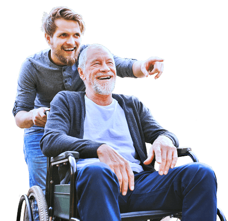 elder man in a wheelchair with caregiver pointing at something