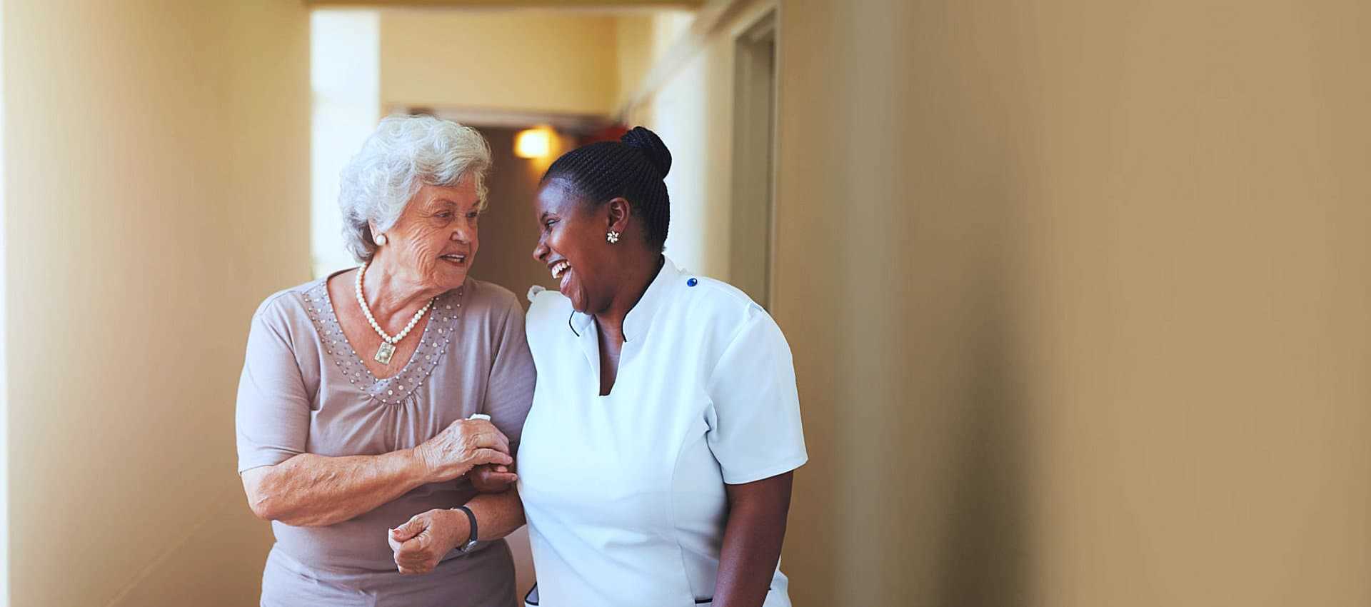 elder woman and caregiver talking